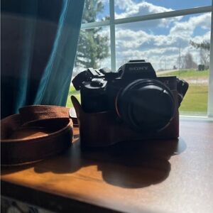 Sony Black Digital Camera with Brown Leather Case and Strap